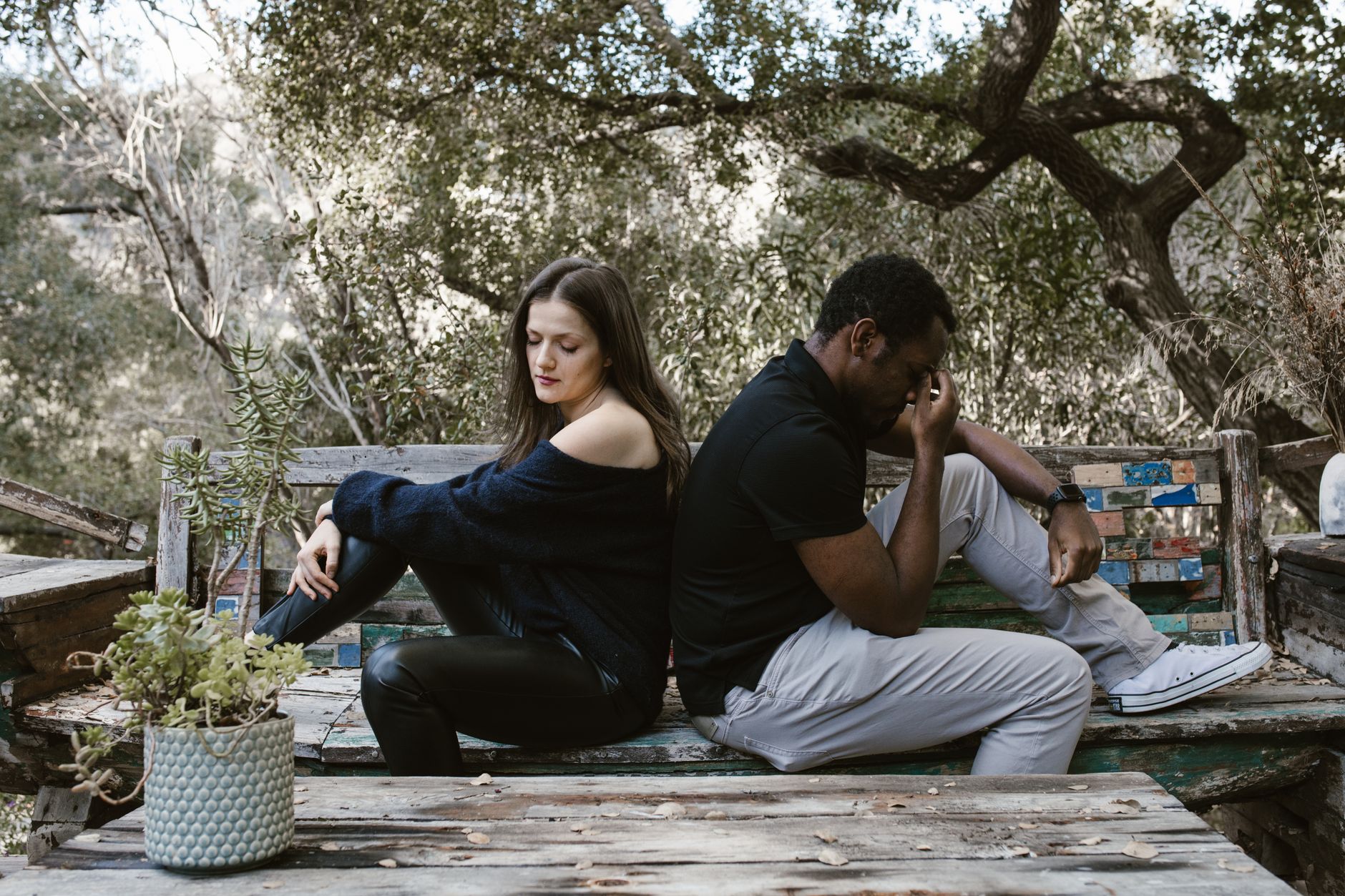 Avoidant partner looking away emotionally distant in a relationship